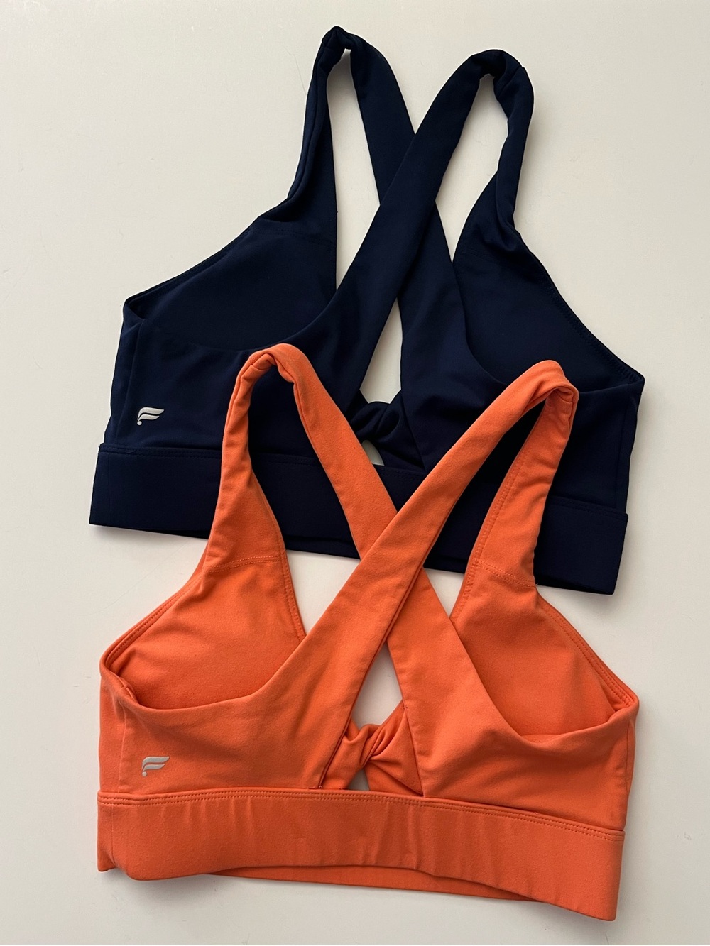 Fabletics | Dual-Pack Cross-Back Sports Bras in Orange & Navy - Picture 2 of 4